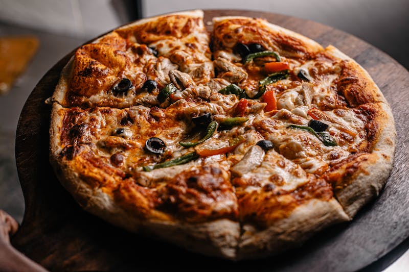 Punch veggie supreme pizza with seasonal vegetables