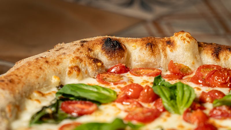 Punch pizza signature pie with prosciutto and arugula